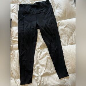 3 pairs of small black leggings